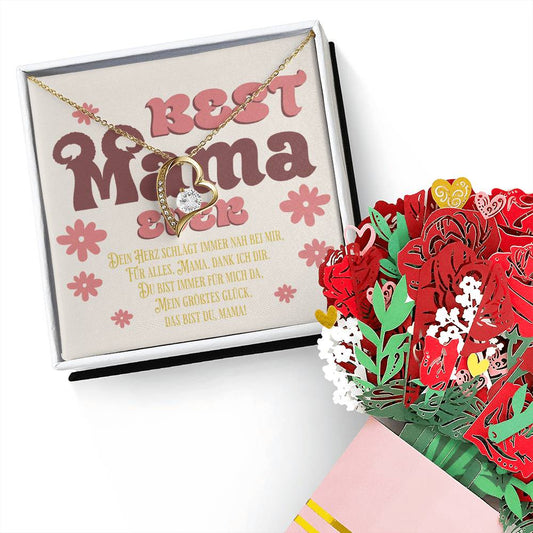 halskette-mit-herzanhänger-und-zirkonia-mit-gelbgold-finish-in-einer-geschenkbox-mit-grußkarte-best-mama-ever-neben-einem-karton-blumenstrauss