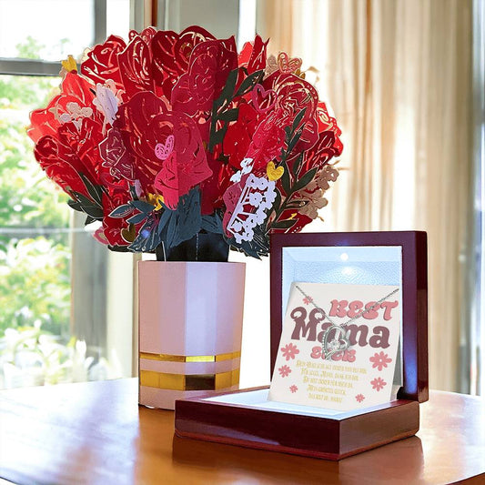 halskette-mit-herzanhänger-und-zirkonia-mit-weissgold-finish-in-einer-geschenkbox-aus-holz-mit-grußkarte-best-mama-ever-neben-einem-karton-blumenstrauss